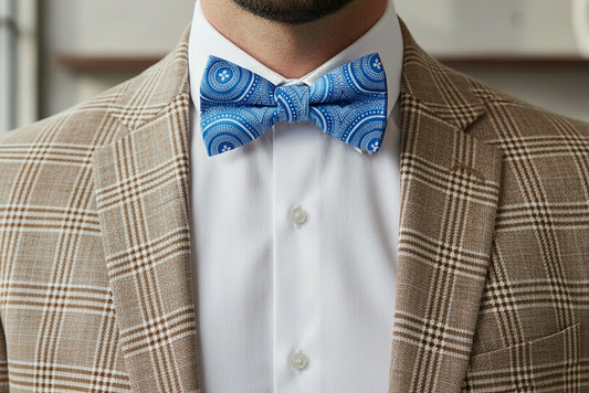 Blue patterned shweshwe tie on a white background