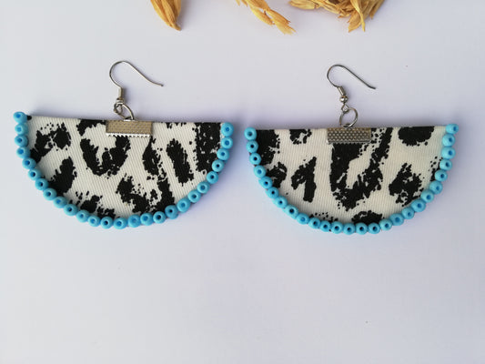 Black and white leopard print earrings with blue beads